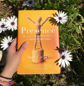 Presence Book cover in a field of flowers.