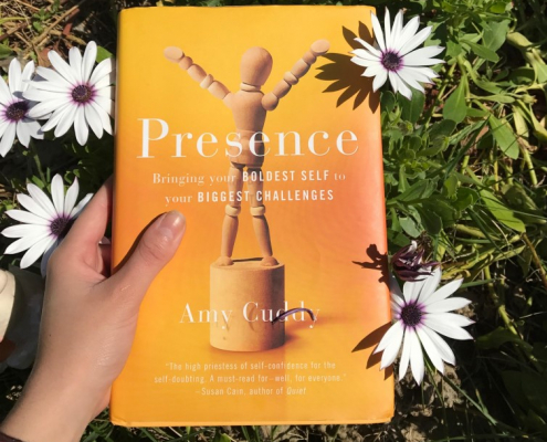 Presence Book cover in a field of flowers.