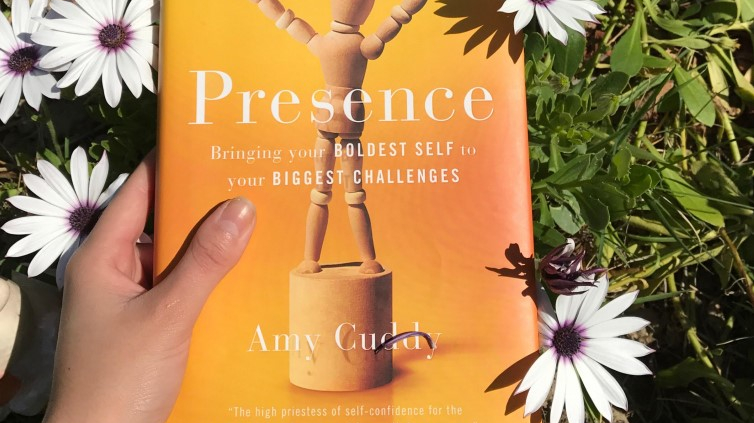 Presence Book cover in a field of flowers.