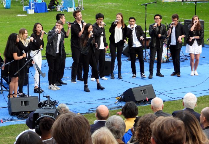 A capella group performs at the celebration