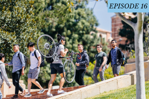 Episode 16 featured image: A student holds a bike while walking up Jans steps