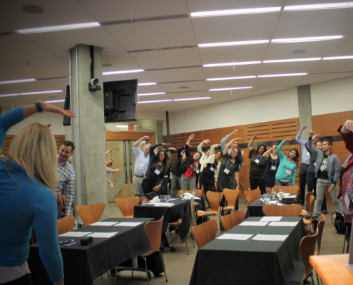 Students stretching at a movewell meeting