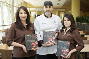 3 of UCLA B-Plate staff hold the B-Plate cookbook.