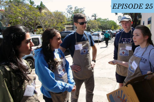 Episode 25 featured image: A woman explains to a group of volunteers.