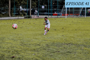 Episode 41 featured image: A young boy kicks a soccer ball