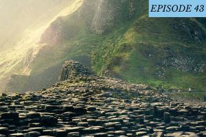 Episode 43 featured image: a rocky path leads to a large green mountain