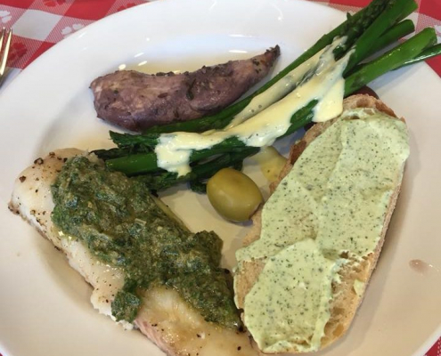 Another dish with fish, carbs and assorted vegetables.