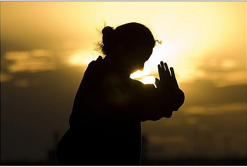 woman meditating in the morning