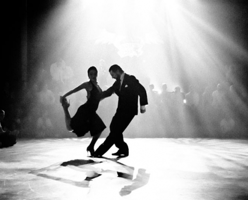man and woman dancing on the dance floor