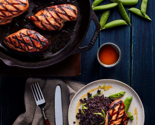 A freshly prepared dinner with seared protein, grains and vegetables.