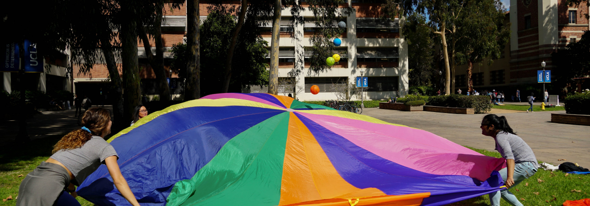 Students playing a childhood game with one another.