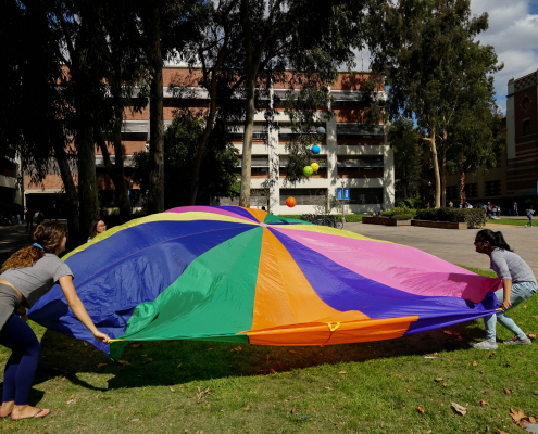 Students playing a childhood game with one another.