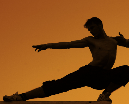 A man practices martial arts.