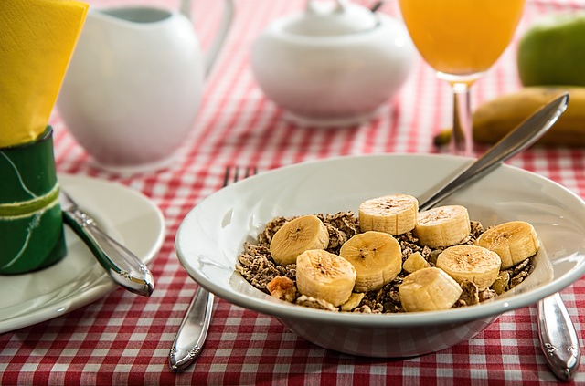 breakfast bowl with grains and sliced banana.
