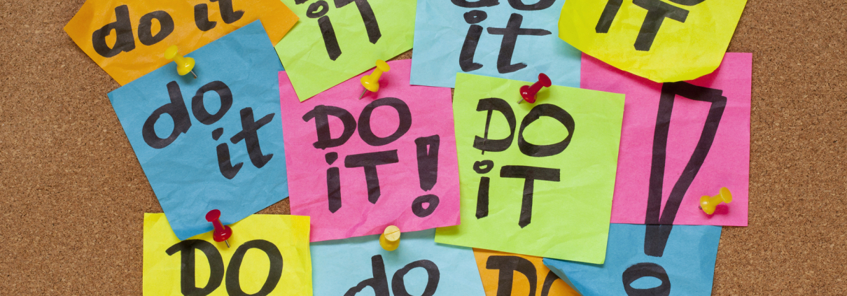 A board of multi-colored post-it notes with, "Do it" written on them.