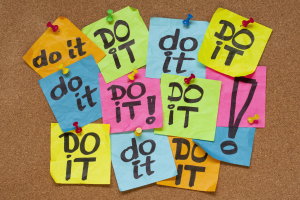 A board of multi-colored post-it notes with, "Do it" written on them.