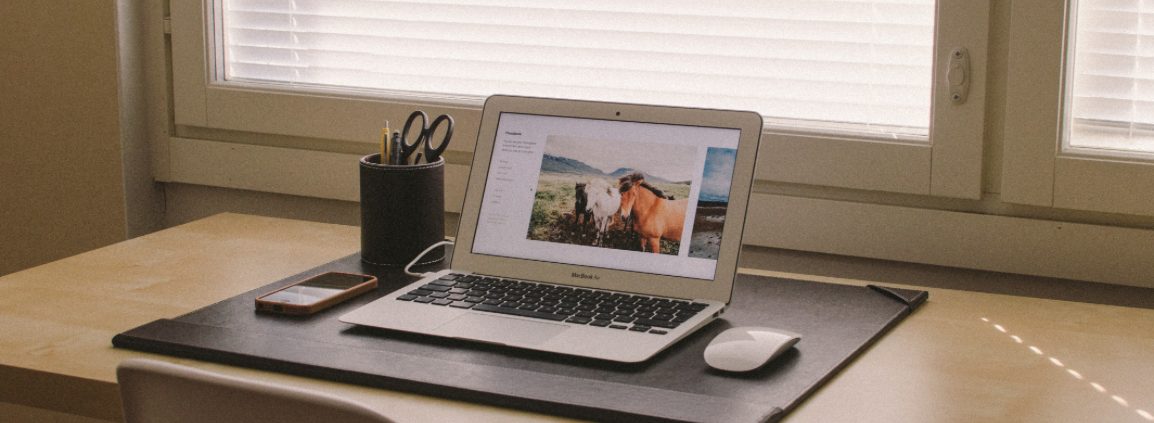 open laptop sitting on top of a table