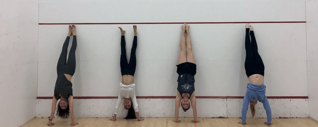 student doing a headstand