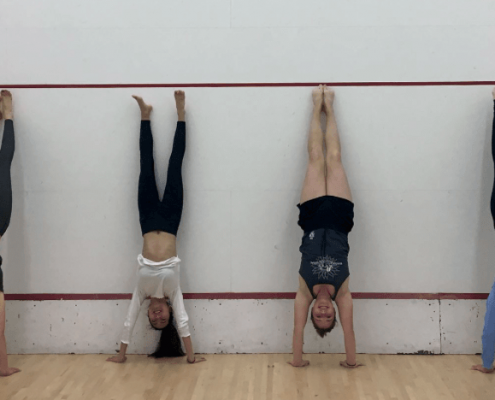student doing a headstand