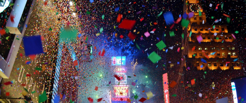 A New Year's celebration shows bright, dazzling confetti in the air.