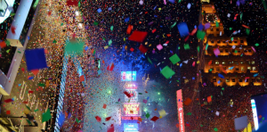 A New Year's celebration shows bright, dazzling confetti in the air.