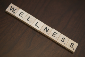 Wooden blocks spell out Wellness.