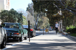 A student walks down the street.
