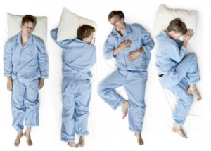 A man lays in 4 various sleeping positions.