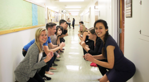 2 lines of people squat in the hallway.