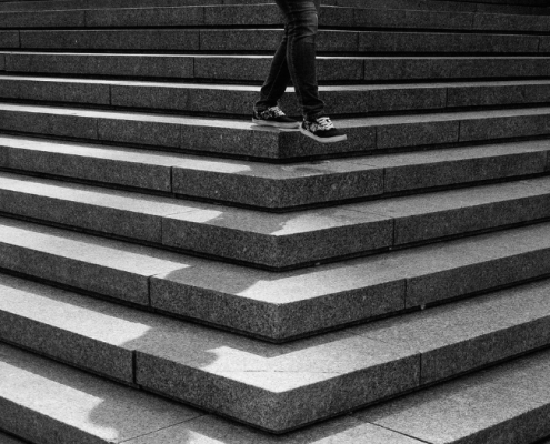 A person walks down the staircase.